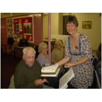 Bridget Crofts, on behalf of the band,presenting Len Purvis with a birthday cakejust a few days before his 90th4th November, 2011The Union Church, HunstantonPhoto Tony Foster - with Bridget's camera!